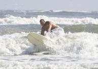 Alt= Mahi Mike surfing